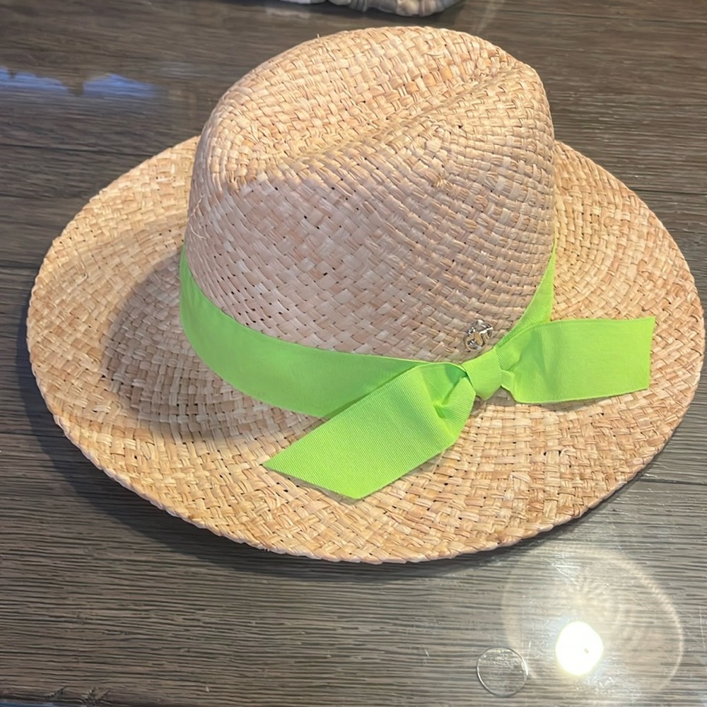 Brand new Nine West straw hat with neon green ribbon around brim. Tags still on!